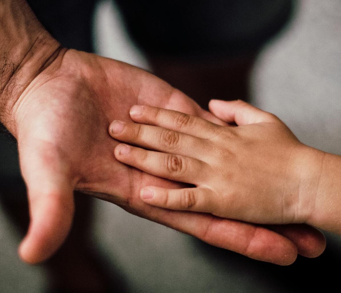 Father and Child's Hands Together